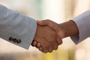 17 July - Public Relations – African Marketing Confederation – African Marketing Confederation Close-up of two people shaking hands in a business context.