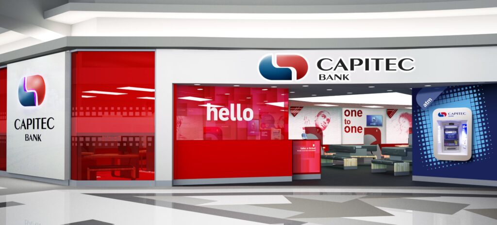 Capitec Bank storefront inside a modern lobby with red glass panels and the bank logo.