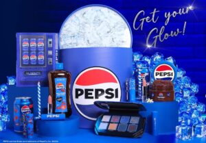 Blue Pepsi promotional display featuring a large round Pepsi logo, ice blocks, and assorted Pepsi products on a blue backdrop.
