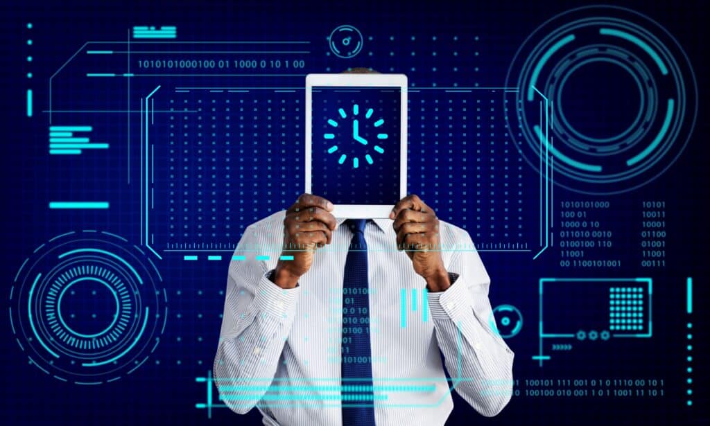 Person in a business shirt and tie holds a tablet up, obscuring their face, with glowing blue futuristic data HUD graphics around it.