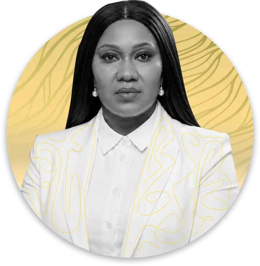 Head and shoulders portrait of a woman with long dark hair white blazer with yellow abstract lines pearl earrings against a yellow circular backdrop