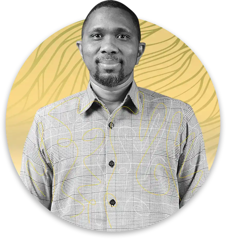 Professional headshot of a man in a checkered button down shirt posed against a yellow circular backdrop with abstract lines