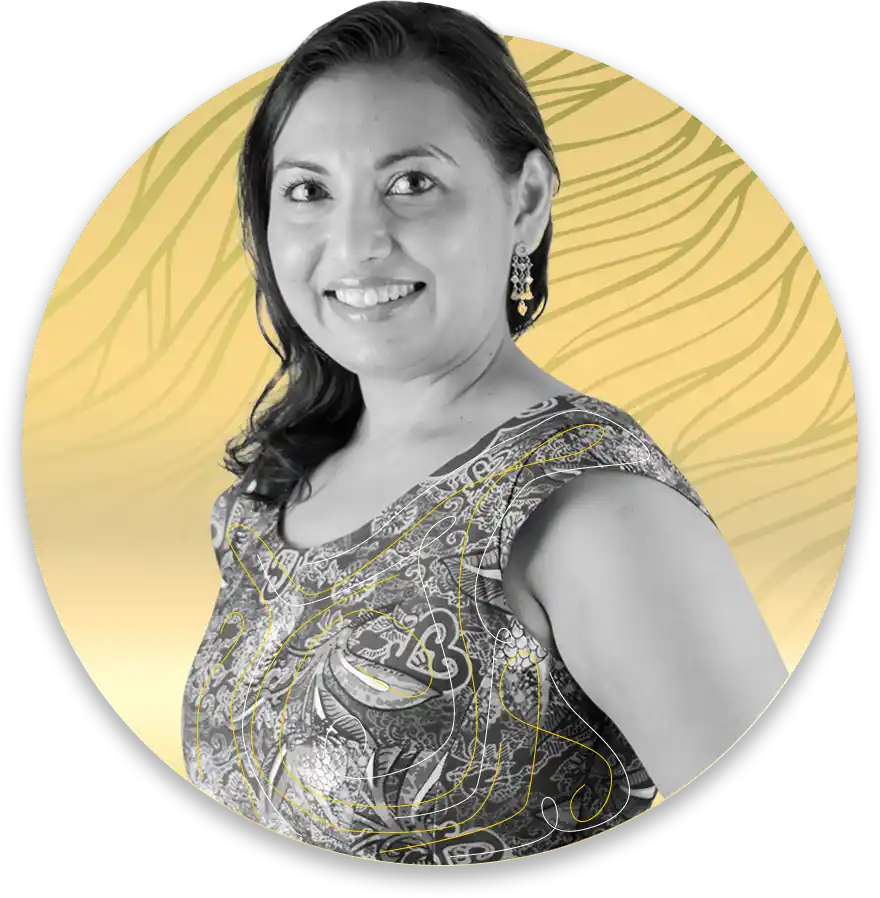 Smiling woman portrait with dark hair and patterned dress gold circular background behind her