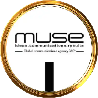 Gold circular badge featuring the muse logo and the tagline &aposideas communications results&apos with &aposglobal communications agency °&apos